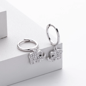 Detailed close-up of S925 sterling silver elephant drop earrings with white zircon stones