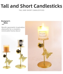 Detail of golden metal candle holder with 3D butterfly and rose flower accents