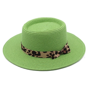 Handwoven light green boater hat with a leopard print ribbon bow for beach vacations
