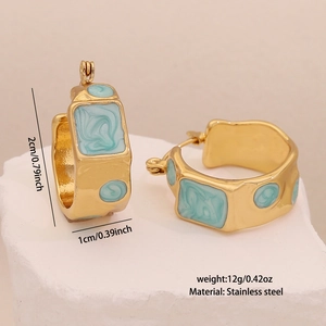 Detailed macro view showing the size and blue marble texture of geometric stainless steel earrings