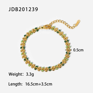 Detail view of 18K gold stainless steel bracelet with green leaf charms and size specs
