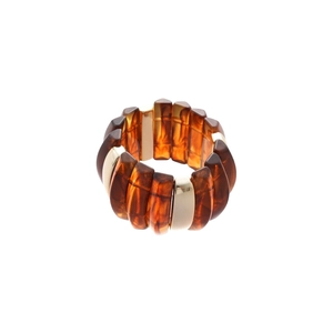 Vintage amber acrylic marbled bracelet with golden metal accents on white background