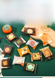 Detail of assorted food-grade heat seal bags for mooncakes with printed designs and inner trays