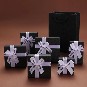 Collection of black lychee grain jewelry boxes and gift bag with fashion jewelry ribbons