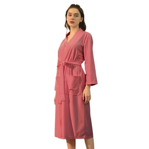 Lightweight pink waffle weave bathrobe for women with V-neck, waist tie and front pockets