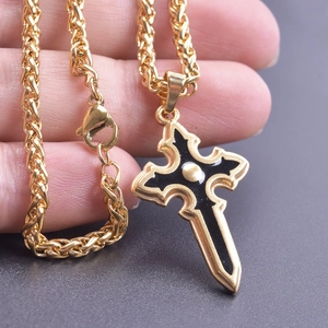 Gothic gold cross pendant necklace with black enamel detail on a twisted rope chain