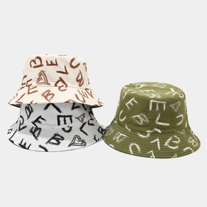 Detail showing graffiti patterns and durable canvas texture on stylish bucket hats
