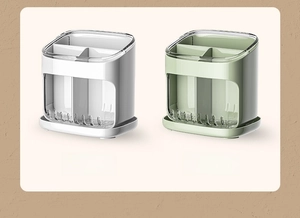 Detail view of transparent white and green divided kitchen utensil drying organizers