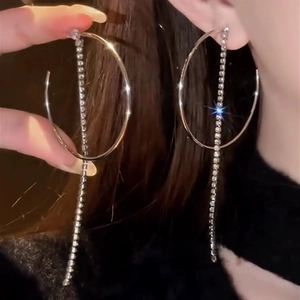 Silver drop earrings with large oval hoop and long sparkling rhinestone tassels