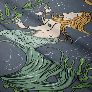 Detailed close-up showing woven texture and mermaid art on fabric tapestry