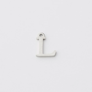 Close-up of a silver stainless steel letter L pendant with a polished mirror finish
