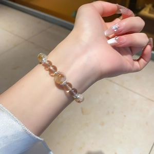 Detail of luxury crystal beaded bracelet with transparent hair crystal beads on wrist