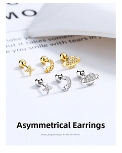 Macro detail of asymmetric star and moon screw back earrings with shimmering cubic zirconia