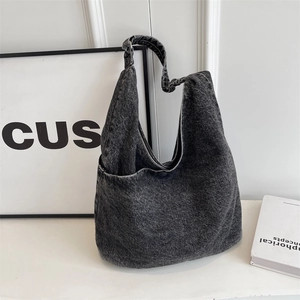 Minimalist dark gray denim tote bag featuring premium texture and wide shoulder straps