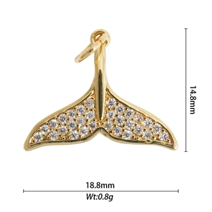 Macro shot of 18.8mm gold-plated whale tail pendant with micro-paved zircons
