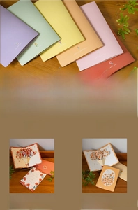 Macro view of 3D pop-up floral greeting cards with colorful envelopes and laser-cut details