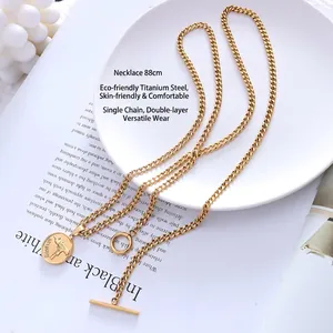 Double-layered 18k gold plated titanium necklace with coin gun pendant and OT clasp
