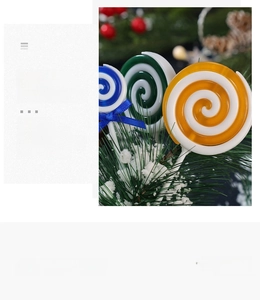 Detailed view of colorful spiral lollipops with festive pine and red berry decoration