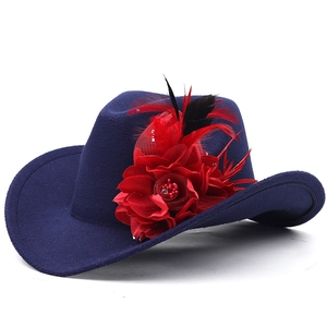 Navy blue felt cowboy hat featuring large red fabric flowers and feather decorations