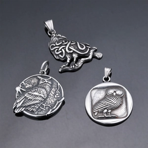 Vintage stainless steel owl pendants with polished silver finish and Celtic relief details