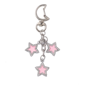 Star keychain with pink enamel charms and rhinestones on a moon-shaped metal clip