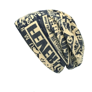 Retro newspaper print beanie hat in beige for street style hip-hop fashion look
