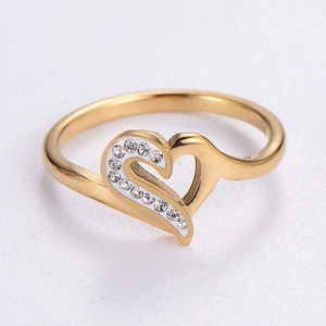 Fashionable gold stainless steel ring featuring interlocking hearts and cubic zirconia stones