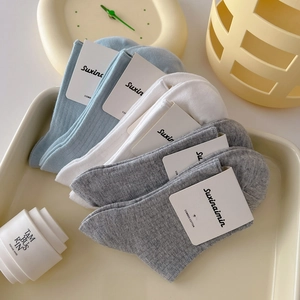 Three-pack ribbed combed cotton crew socks in sky blue, white, and heather grey tones