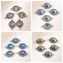 Detailed view of alloy evil eye and north star heart charms for DIY jewelry making