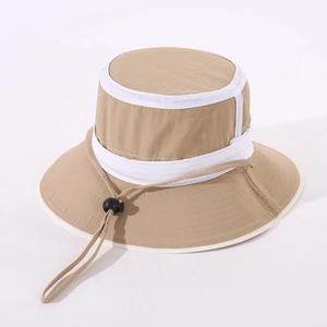 Detail of beige kids bucket hat showing adjustable windproof drawstring and white trim