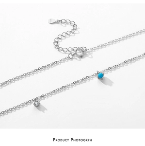 Close-up of S925 sterling silver chain with turquoise bead and zircon pendant