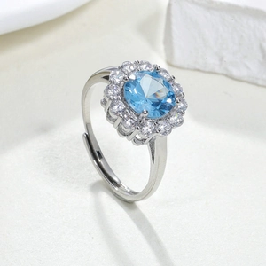 Luxury adjustable silver ring with round blue spinel and sparkling halo cluster stones