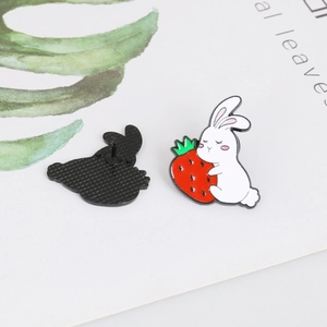 Detailed front and back view of cartoon rabbit enamel pins with secure metal clasp