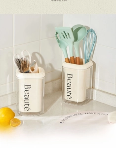 Dual-size cream cutlery organizers with Beauté text on a modern kitchen countertop