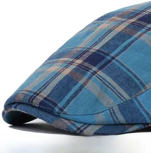Close-up of the fine stitching and blue plaid cotton fabric on the curved cap brim