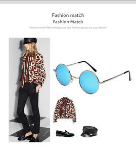 Retro round metal sunglasses with blue coated lenses shown in a fashion editorial layout