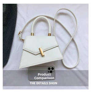 White trapezoidal PU handbag with golden metal lock and long strap shown with phone for scale