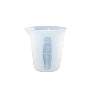 Macro view of 100ml silicone measuring cup showing precise scales and pouring spout