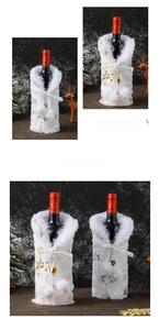 Detail of Christmas wine bottle cover with faux fur collar and gold snowflake pattern