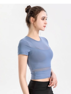 Detail of blue sports top with breathable mesh panels and high-stretch quick-dry fabric