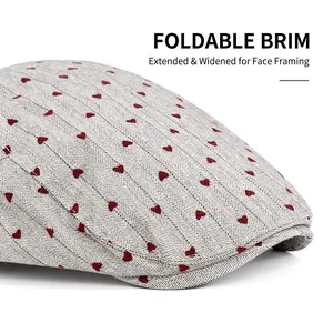 Light gray herringbone newsboy hat with red heart embroidery and foldable wide brim