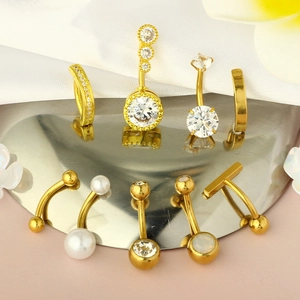 Detailed set of nine gold-plated stainless steel navel rings with opal and zircon inlays