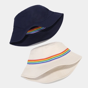 Reversible navy and beige cotton sun hat with vibrant rainbow stripe ribbon detail