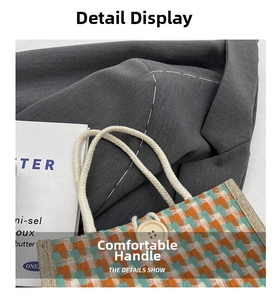 Close-up of woven jute tote bag with colorful plaid pattern and white rope handle