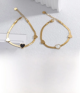 Detail of gold shell heart bracelet in titanium steel with vacuum plating finish