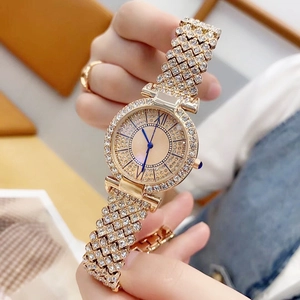 Luxurious gold quartz watch for women fully iced out with sparkling crystals and blue hands