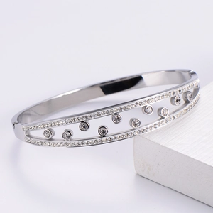 Detailed close-up of silver-plated titanium steel bracelet with sparkling double-row zircons