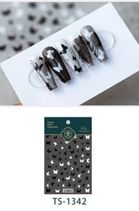 Detail of TS-1342 nail stickers featuring black and white butterfly and star patterns