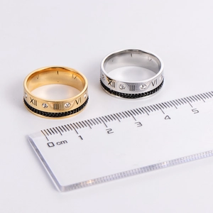 Main gold and silver hollow roman numeral rings with inlaid diamonds and chain design
