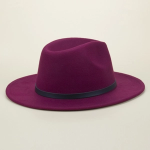 Close-up of deep purple wide-brim wool fedora hat with a black decorative band